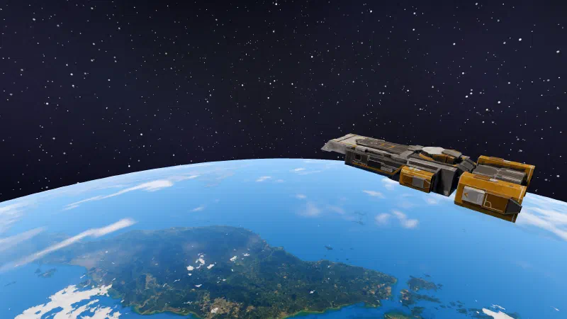 The carrier in low orbit over Sumatra, with the curve of the Earth behind it.