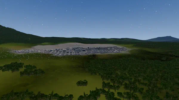 A generated town of low grey blocks on a green plain, forested ridges and a volcano behind.